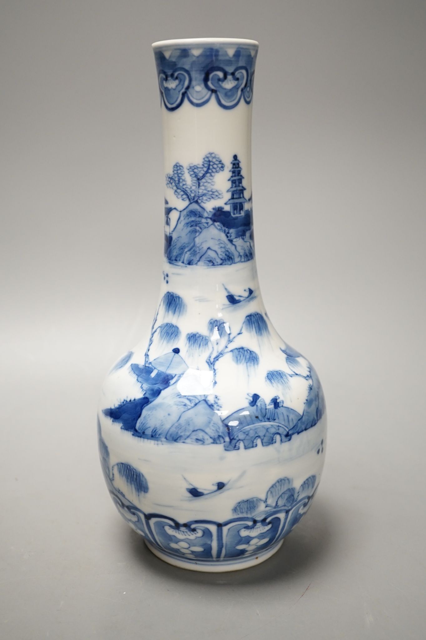 A Chinese blue and white bottle vase, Kangxi mark but 19th century. 25cm